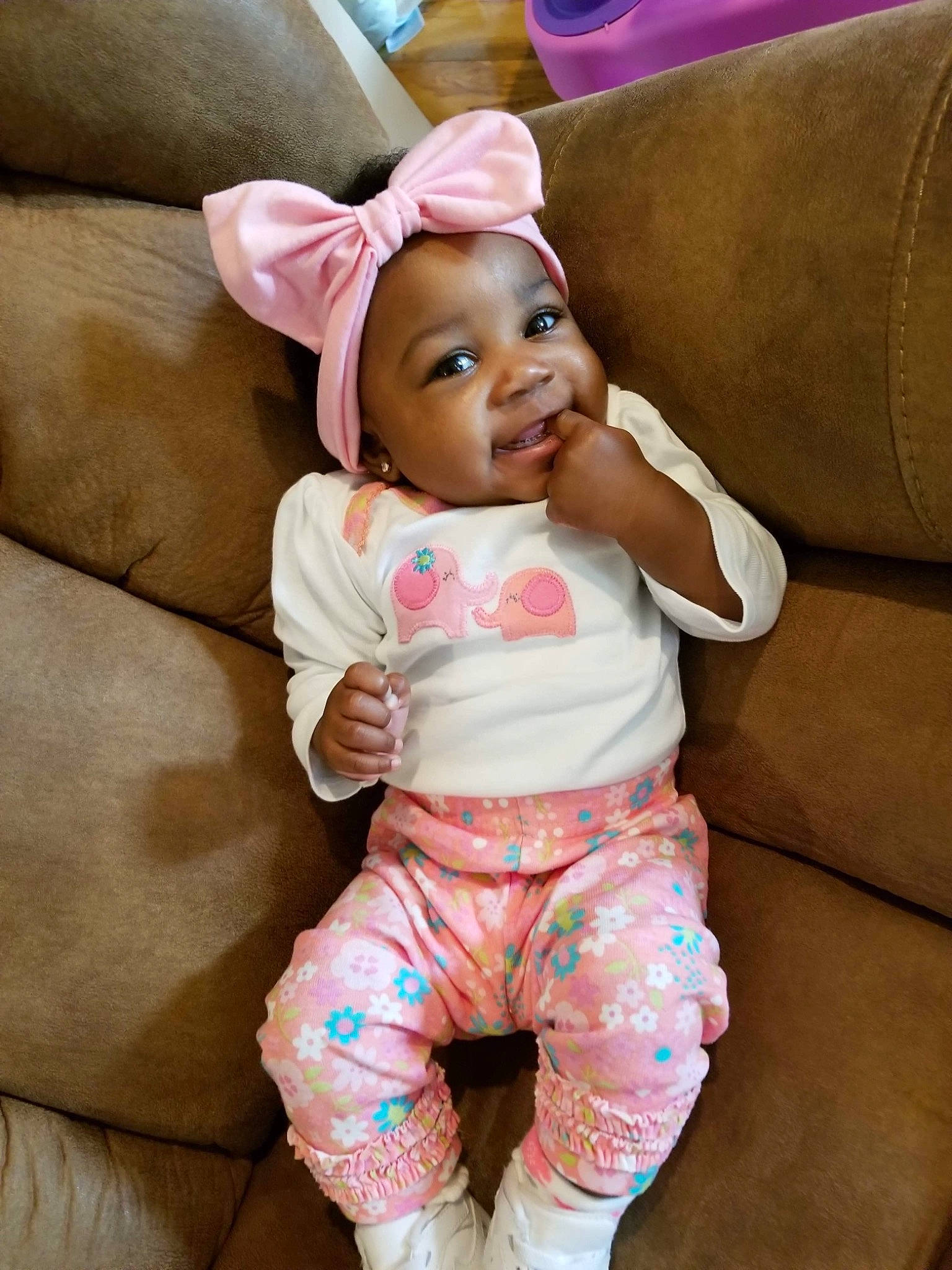 Kelani is registered to the contest to win money with this photo: child, ear, hair_accessory, headgear, infant, person, pink, product, skin, toddler