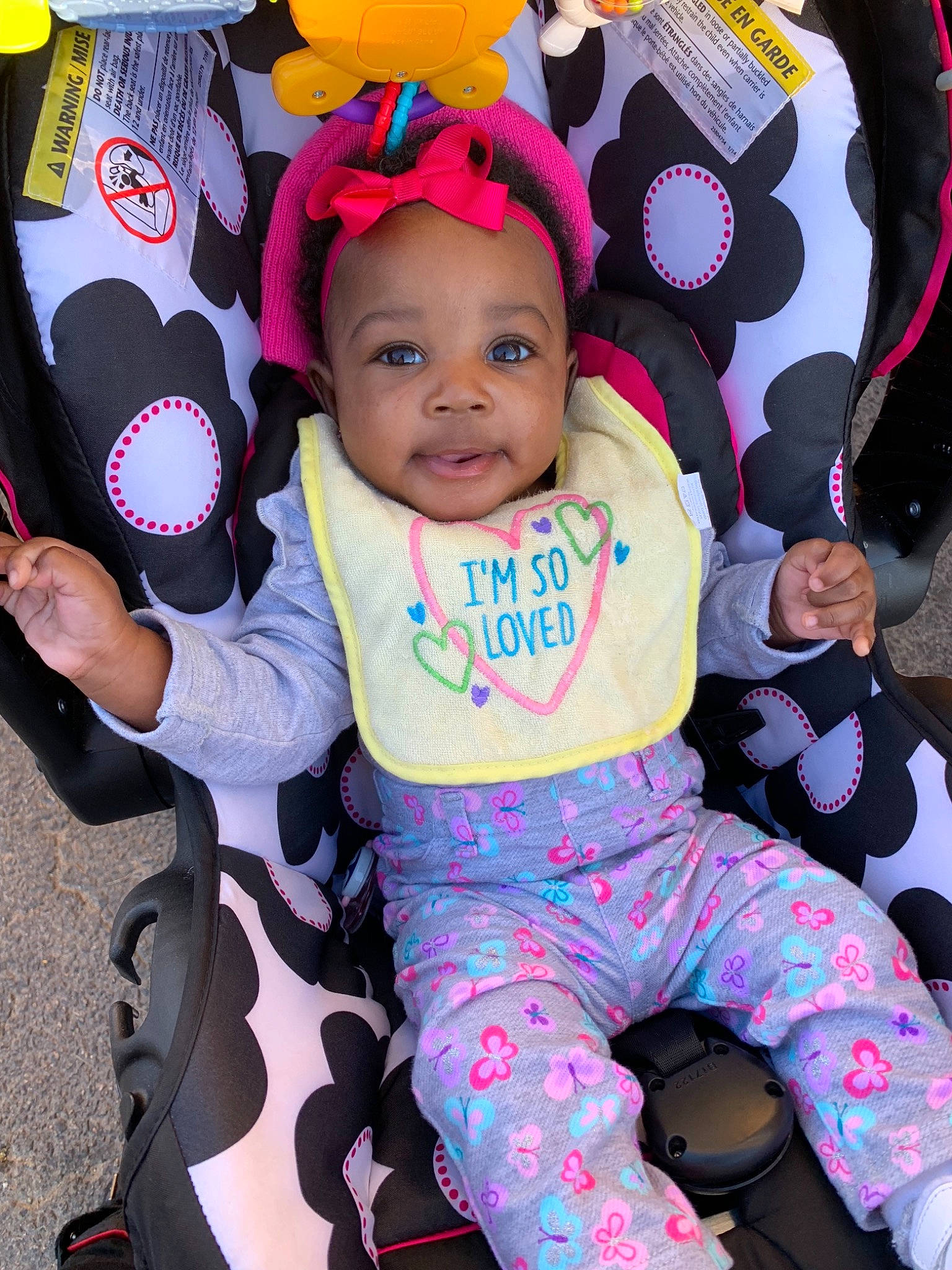 Kelani is registered to the contest to win money with this photo: baby_carriage, baby_products, child, fun, girl, headgear, person, pink, product, purple, smile, textile, toddler