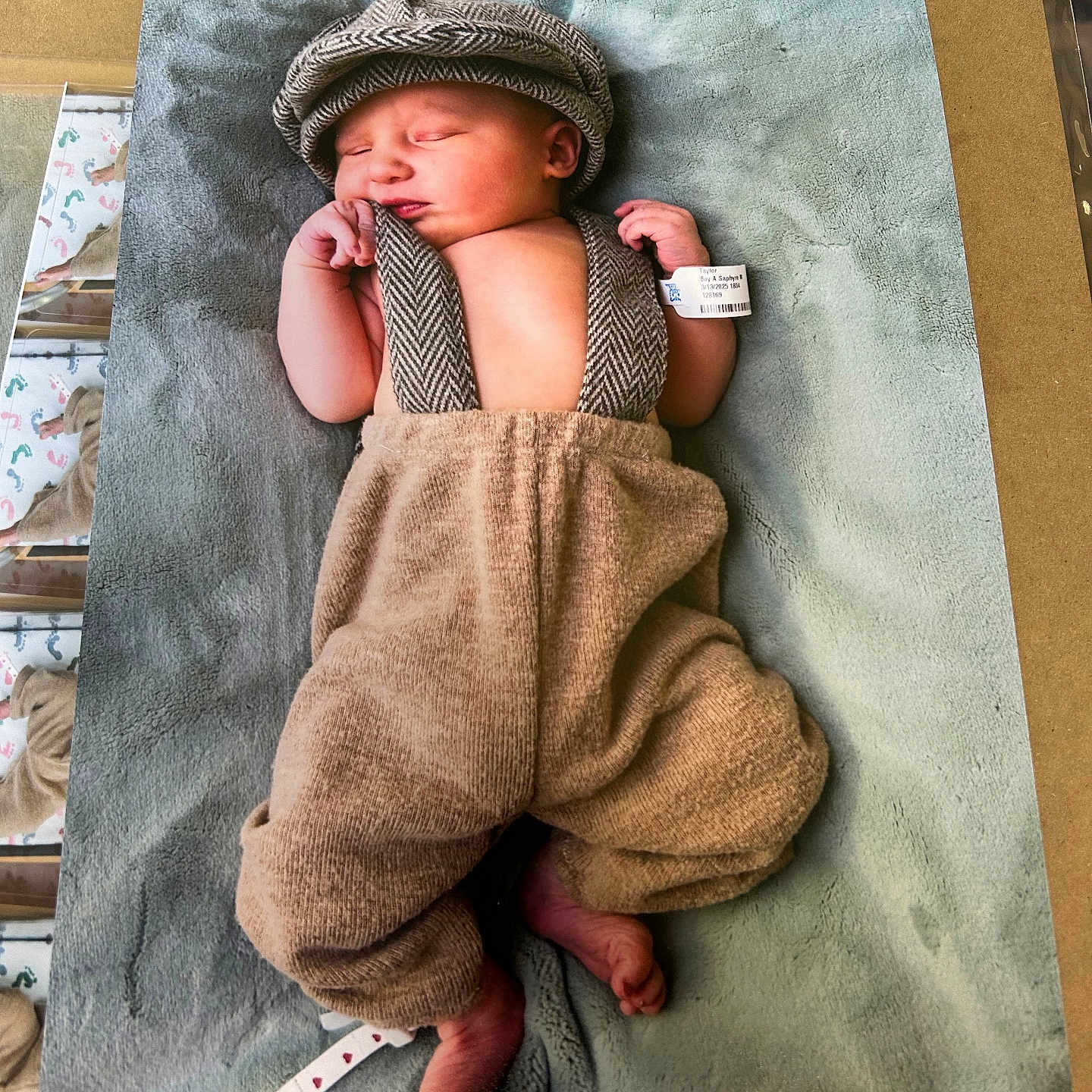 Dalvin is registered to the contest to win money with this photo: architecture, baby, blanket, bonnet, building, clothing, document, drivinglicense, face, furniture, hat, head, idcards, newborn, person, photography, portrait, sleeping, text, towel