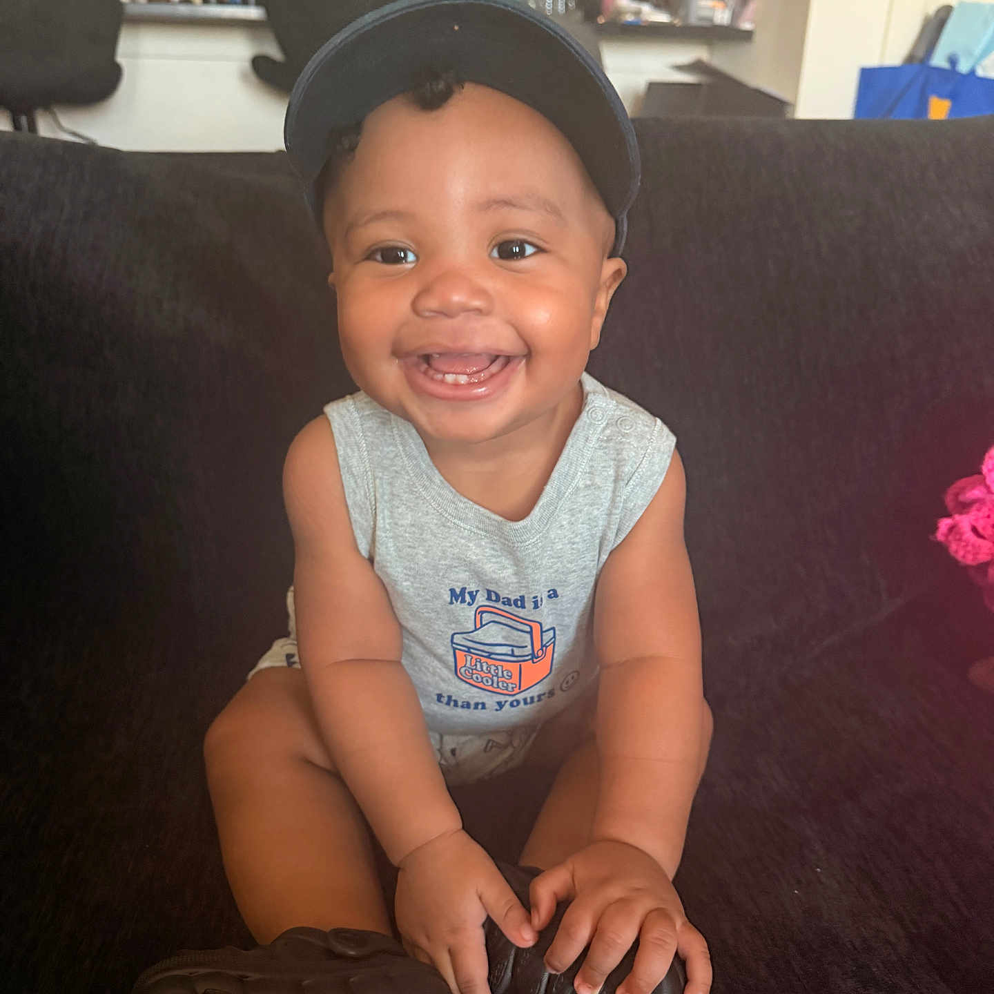Savyon joined the competition — help win amazing prizes! baby, toddler, smiling, cap, sleeveless_shirt, indoor, couch, child, happy, person, furniture, kitchen, household, seated, cute, portrait, young_child, bright, expression, casual