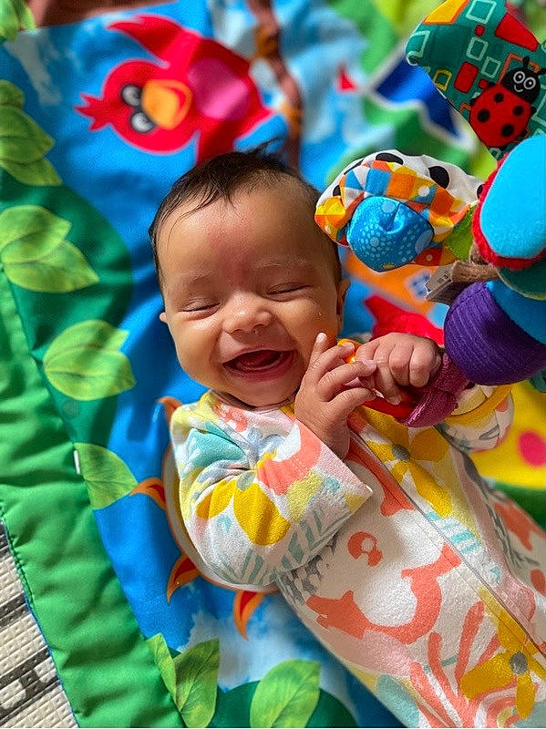 Farren Brown joined the competition — help win amazing prizes! baby, baby_products, baby_toddler_clothing, child, facial_expression, fun, grass, happy, leisure, pattern, people, people_in_nature, person, pink, plant, product, sleeve, smile, t_shirt, textile