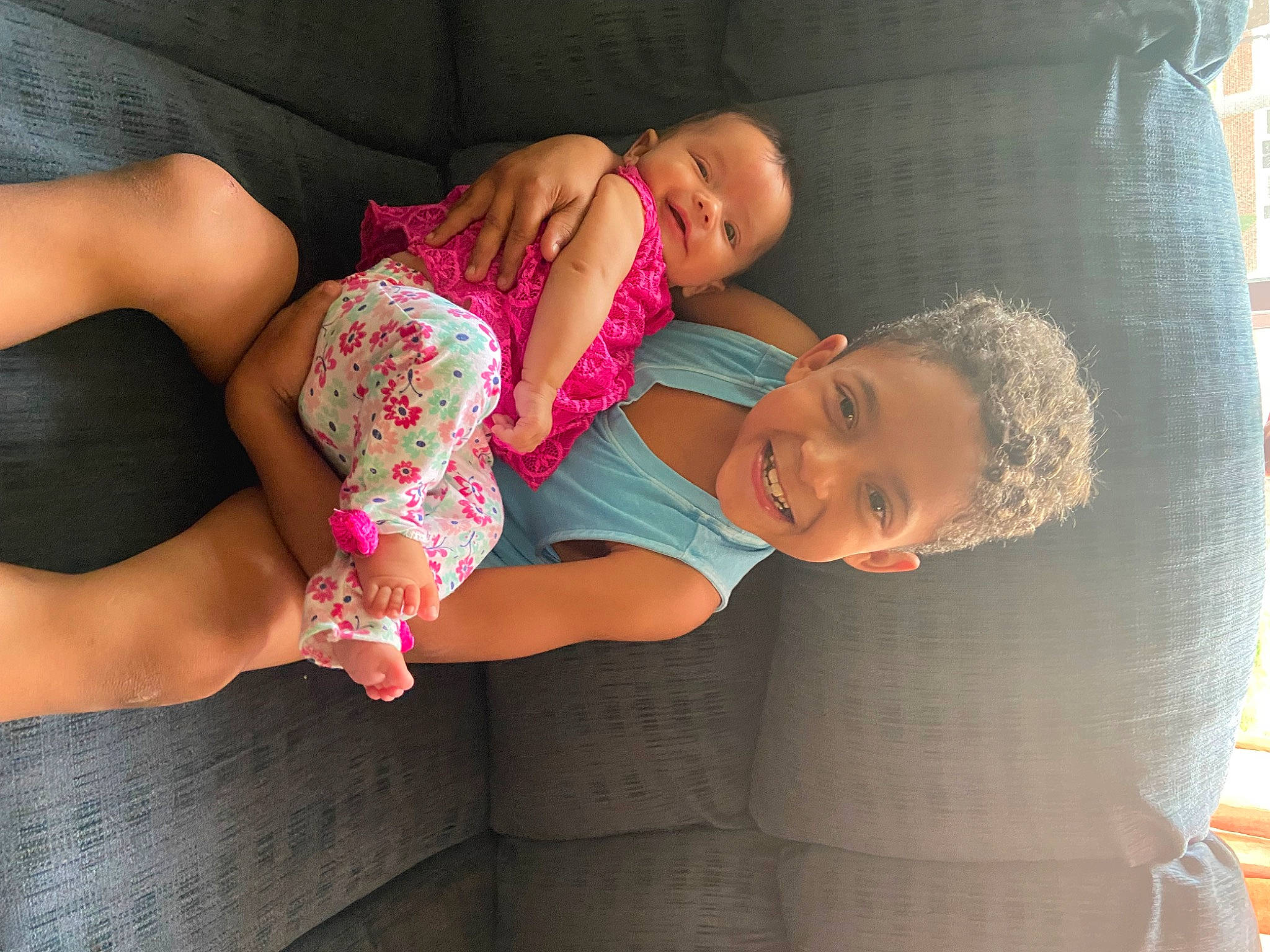 Messiah Lee is registered to the contest to win money with this photo: comfort, elbow, facial_expression, finger, fun, glasses, happy, human_body, interaction, joint, joy, knee, leg, neck, person, shoulder, skin, smile, t_shirt, thigh