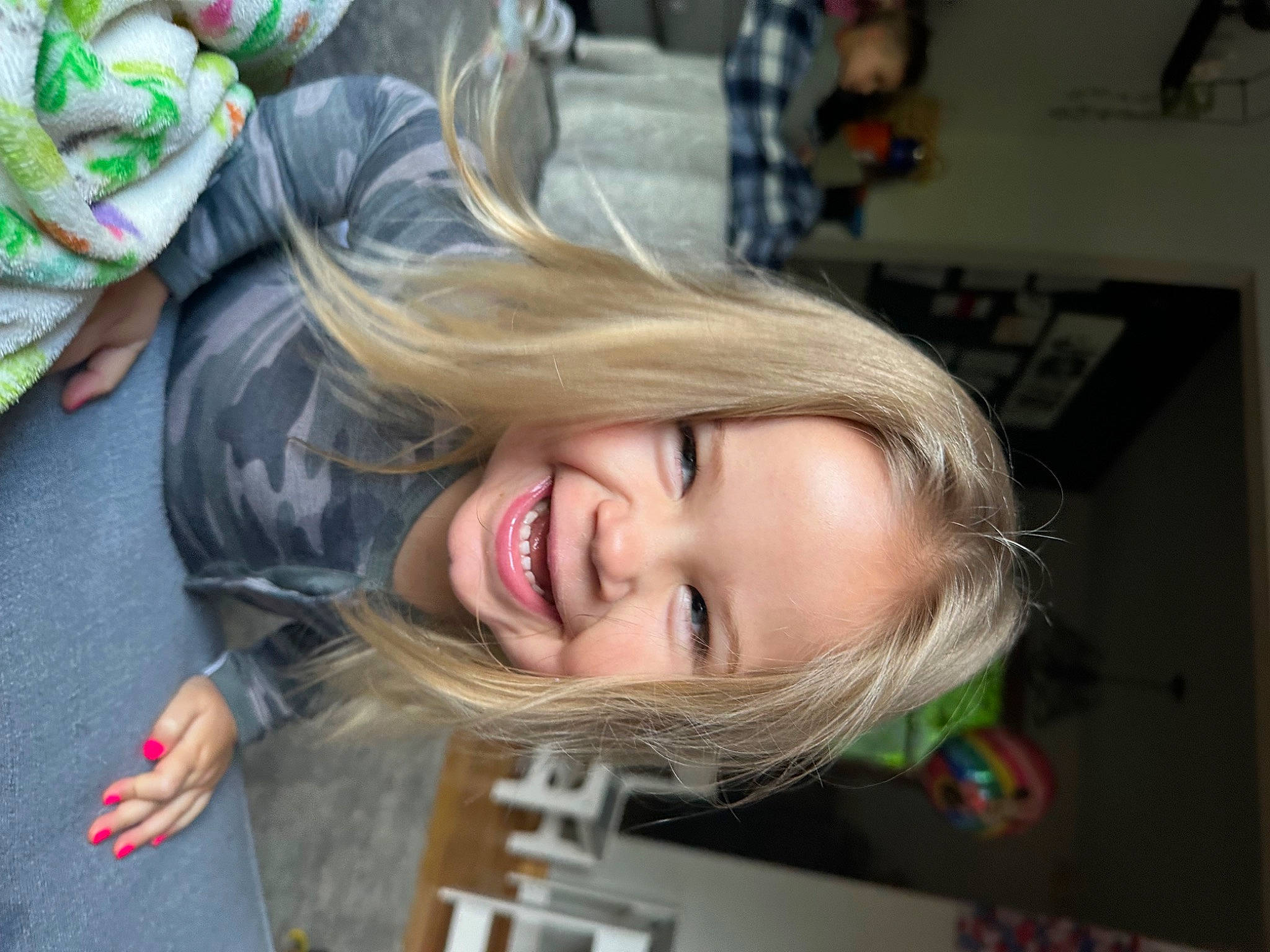 Rylan is registered to the contest to win money with this photo: asphalt, blond, brown_hair, child, eyelash, facial_expression, feathered_hair, fun, grass, hair_coloring, hairstyle, happy, joy, laugh, leisure, lip, person, portrait_photography, road, sitting