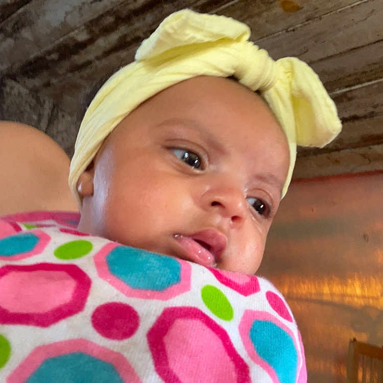 Gabriella joined the competition — help win amazing prizes! baby, blanket, bodypart, bonnet, cap, clothing, couch, face, finger, hand, hat, head, indoors, newborn, person, photography, plywood, portrait, towel, wood