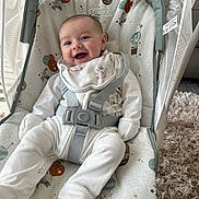 Bella-Rose joined the competition — help win amazing prizes! baby, infant, smile, happy, pajamas, bib, baby_rocker, graco, seatbelt, pattern, toy, indoor, carpet, baby_toy, mesh, fabric, face, person, child, comfort