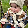 Dawson joined the competition — help win amazing prizes! casual_clothing, child, cute, fun, grass, greenery, happy, knit_hat, metal_chain, outdoor, park, person, plaid_jacket, playground, seat, smile, swing, toddler, winter_clothing, young_child