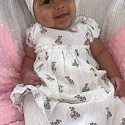 Aurora is registered to the contest to win money with this photo: animal, baby, bed, bird, bonnet, cap, clothing, cushion, dress, face, furniture, hat, head, homedecor, linen, newborn, penguin, person, photography, portrait