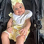 Aurora is registered to the contest to win money with this photo: accessories, baby, bed, bodypart, bonnet, cap, clothing, diaper, dress, face, finger, furniture, hat, head, newborn, person, photography, portrait, strap, stroller