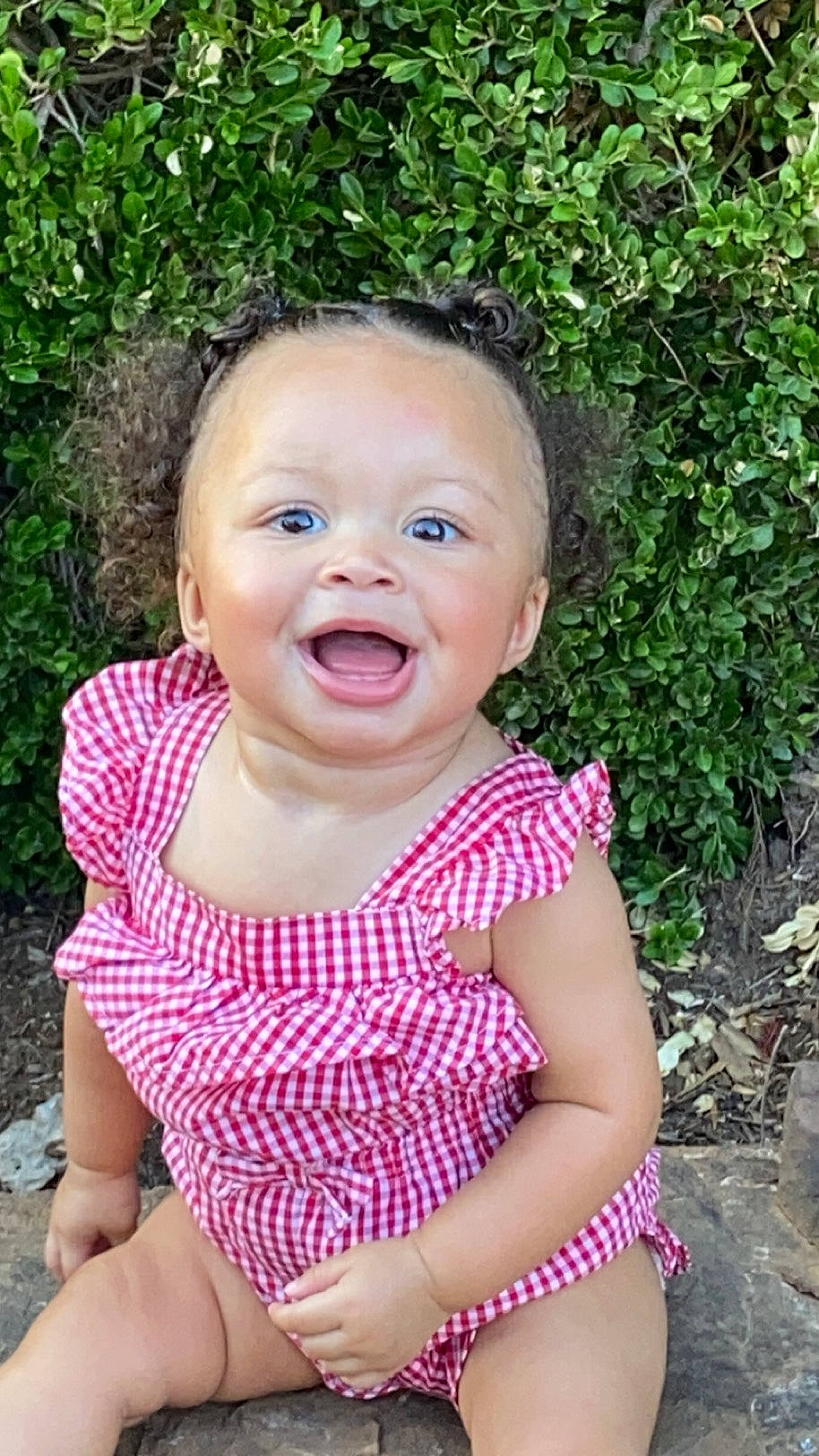 Avionna is registered to the contest to win money with this photo: baby, baby_laughing, baby_toddler_clothing, cheek, dress, eye, facial_expression, grass, happy, iris, leaf, lip, nose, people_in_nature, person, pink, plant, sleeve, smile, summer