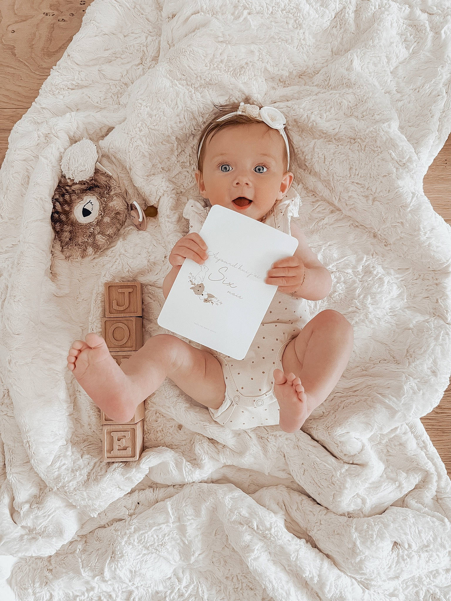 Joyce participe au concours pour gagner de l'argent avec cette photo : baby, baby_toddler_clothing, bridal_accessory, comfort, doll, dress, embellishment, eyebrow, eyelash, fashion_design, fur, happy, headgear, headpiece, iris, linens, person, pink, skin, surprise