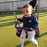 child, toddler, swing, playground, outdoor, sunlight, grass, clothing, pants, sweatshirt, chains, seat, person, baby, cute, expression, toy, play, daylight, park