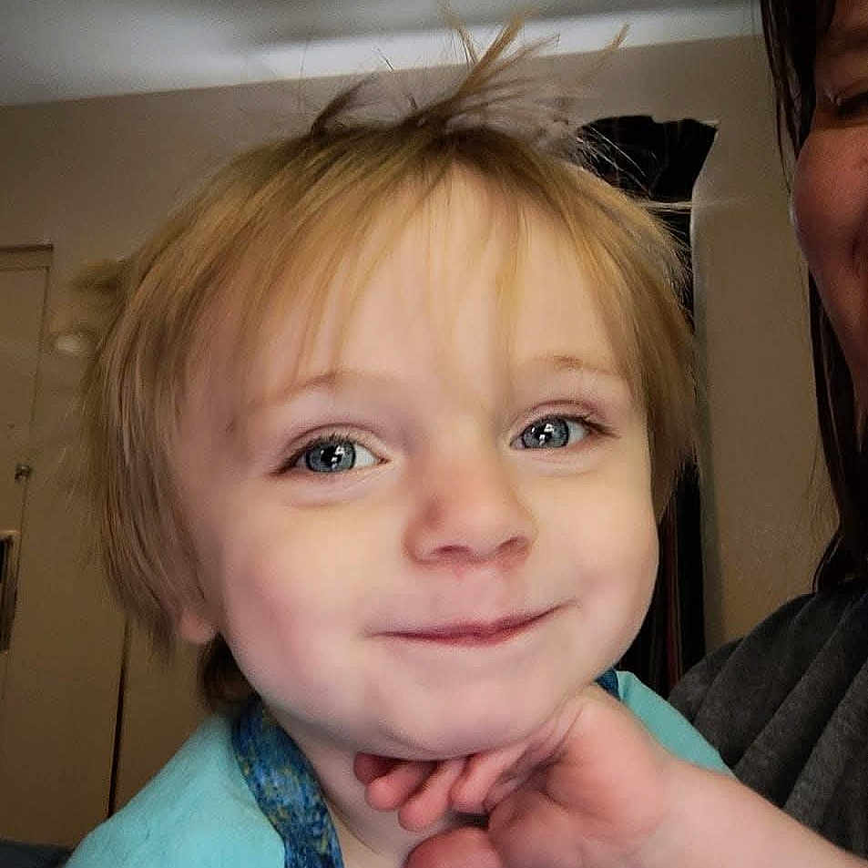 Odin joined the competition — help win amazing prizes! adult_partial, blue_clothing, child, closeup, cute, expression, face, hair, hand, happy, head, indoor, light, person, portrait, room, skin, smiling, toddler, young_child