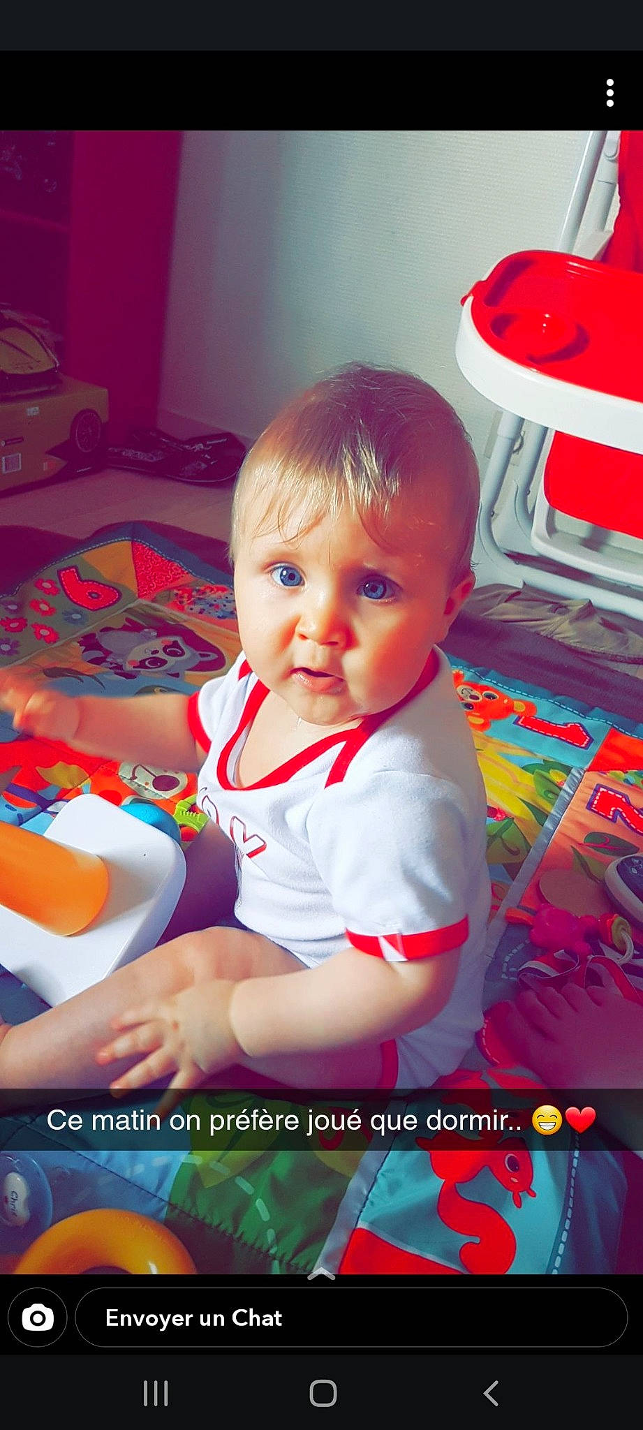 Chris participe au concours pour gagner de l'argent avec cette photo : baby, cheek, child, fun, mouth, person, photo_caption, play, product, sitting, smile, toddler