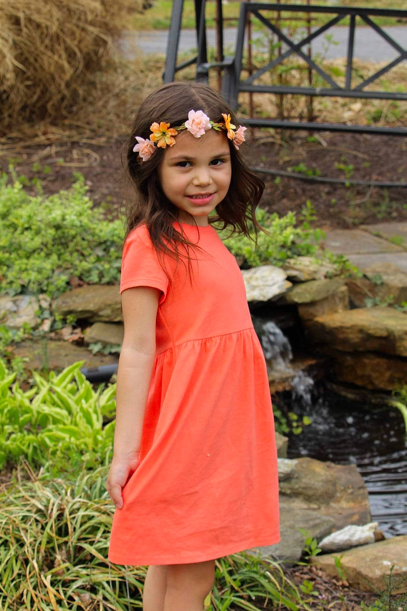 Aleena is registered to the contest to win money with this photo: black_hair, botany, brown_hair, day_dress, face, fawn, formal_wear, grass, happy, headwear, jewellery, joy, leaf, long_hair, neck, necklace, one_piece_garment, people_in_nature, person, plant