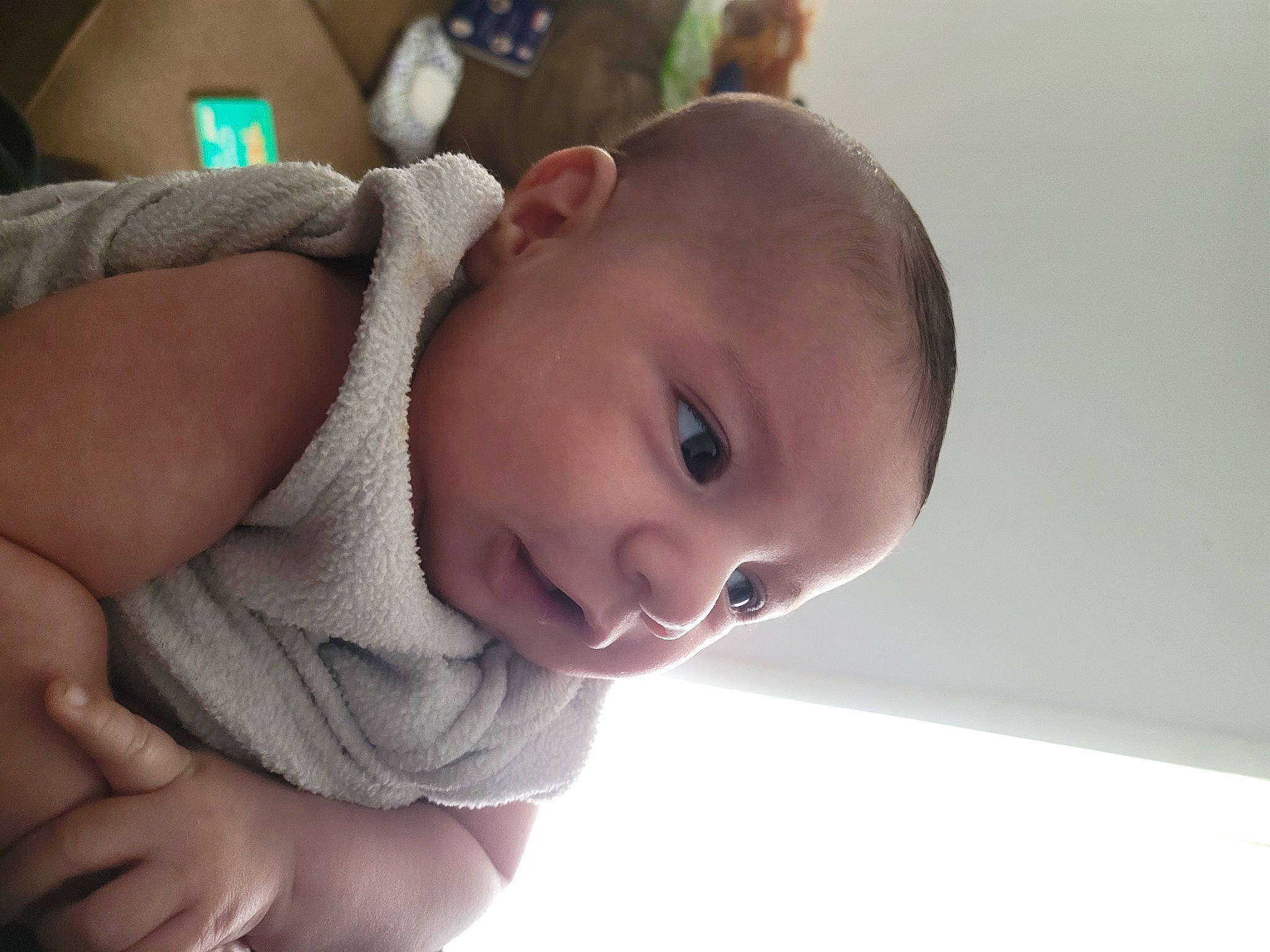 Johnathan is registered to the contest to win money with this photo: arm, baby, baby_toddler_clothing, cheek, chin, ear, eye, eyelash, gesture, hand, happy, iris, lip, mouth, nose, person, product, skin, sleeve, smile