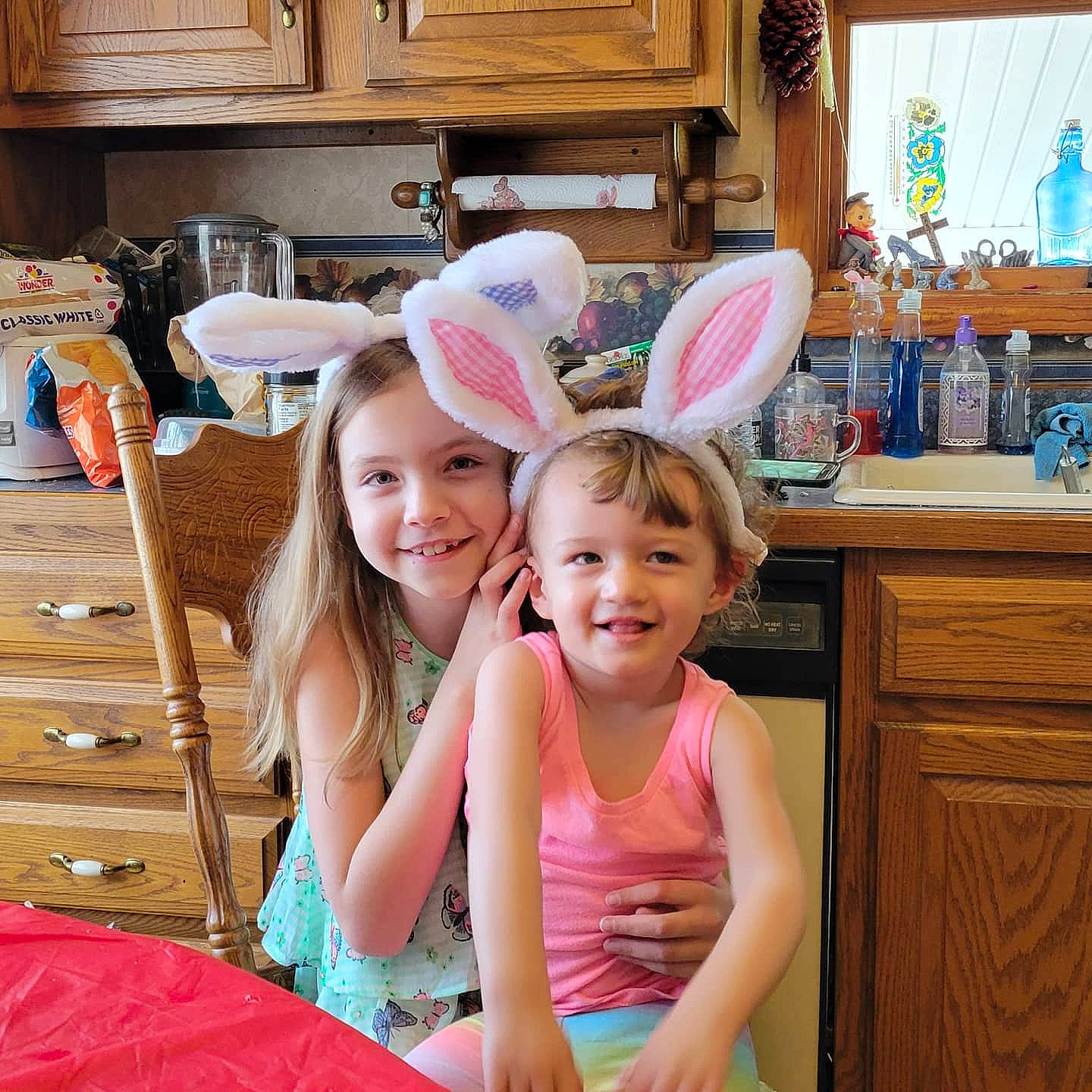 Mikayla is registered to the contest to win money with this photo: cabinetry, chair, fun, furniture, happy, hat, human_body, joy, leisure, person, pink, plate, room, shelf, shorts, smile, snapshot, summer, t_shirt, tableware