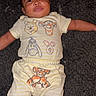 Jeremiah joined the competition — help win amazing prizes! baby, infant, child, lying_down, carpet, clothing, onesie, yellow, white, winnie_the_pooh, tigger, eeyore, piglet, toddler, cute, smile, face, person, indoors, soft
