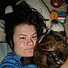 Koda is registered to the contest to win money with this photo: person, dog, cuddle, indoor, pillow, blanket, closeup, casual, brindle, collar, face, hair, relax, bedroom, comfort, expression, resting, blue_shirt, container, toy