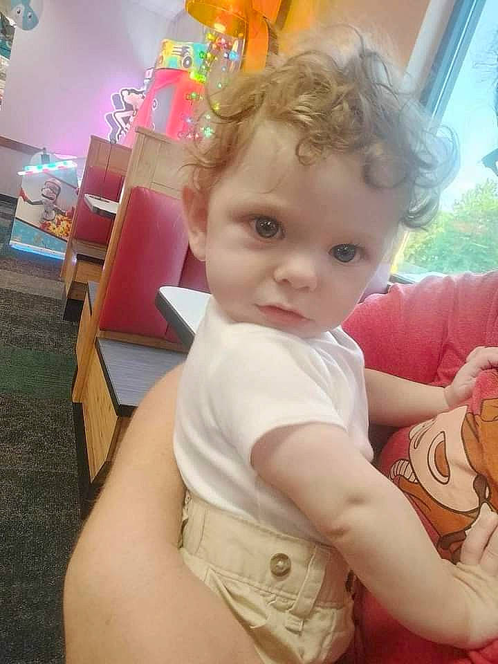 Jamison is registered to the contest to win money with this photo: baby, baby_toddler_clothing, cheek, chest, child, elbow, flooring, fun, grass, happy, human_body, human_leg, leisure, person, plant, sitting, skin, thigh, thumb, toddler