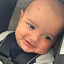 Ezekiel is registered to the contest to win money with this photo: baby, child, car_seat, smile, face, infant, happiness, close_up, seatbelt, cute, young_child, portrait, safety, clothing, black_strap, cheek, indoors, expression, head, person