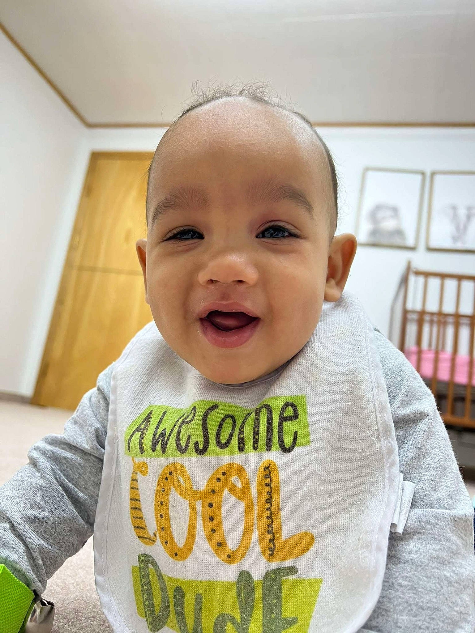 Jedidiah is registered to the contest to win money with this photo: baby, baby_toddler_clothing, cheek, chin, cool, eye, eyebrow, facial_expression, flooring, happy, mouth, neck, nose, outerwear, person, product, skin, sleeve, smile, t_shirt