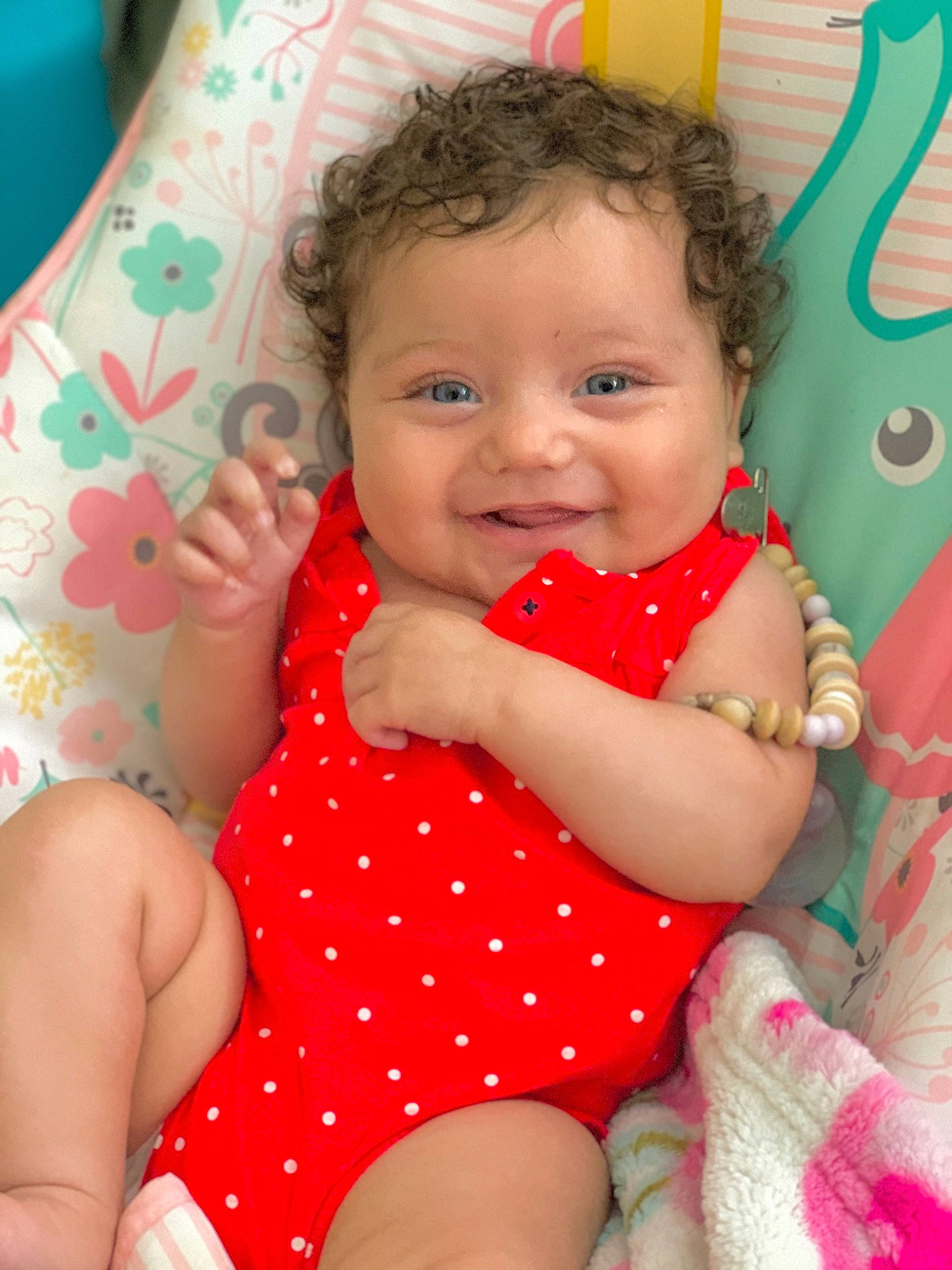 Ellyana joined the competition — help win amazing prizes! baby, cheek, child, face, finger, iris, joy, pattern, person, pink, polka_dot, sitting, skin, smile, toddler