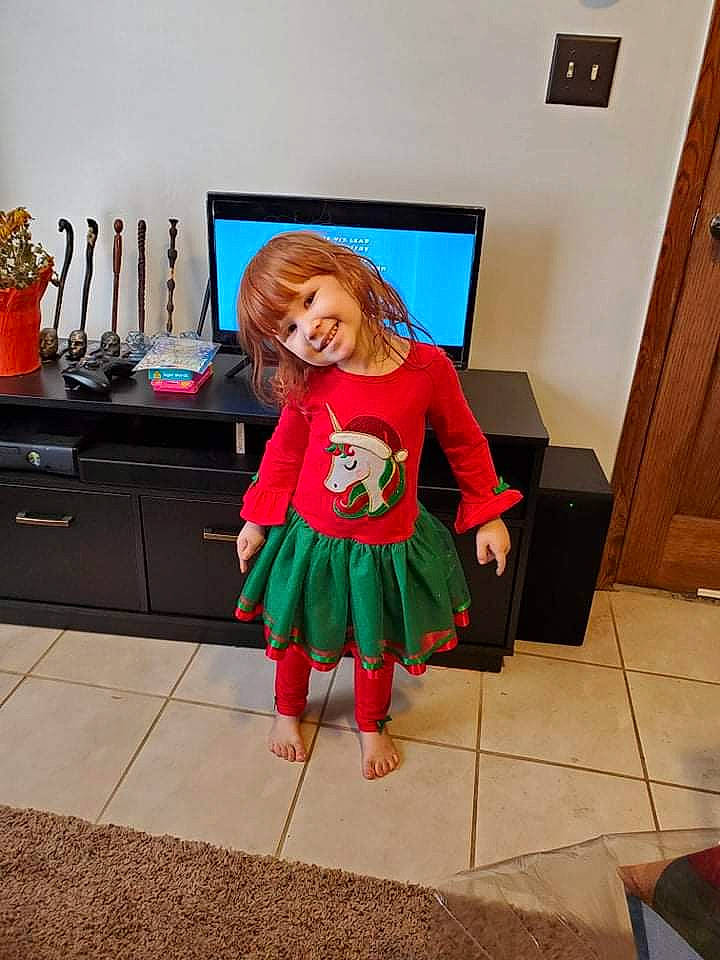 Nicole is registered to the contest to win money with this photo: cabinetry, door, drawer, electronic_device, event, fashion_design, floor, flooring, flowerpot, fun, head, human_body, interior_design, joy, living_room, person, plant, smile, standing, table