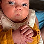 Koda joined the competition — help win amazing prizes! baby, infant, face, hands, clothing, vest, yellow_sleeves, expression, portrait, indoor, person, cute, closeup, skin, newborn, child, young, human, soft_lighting, casual