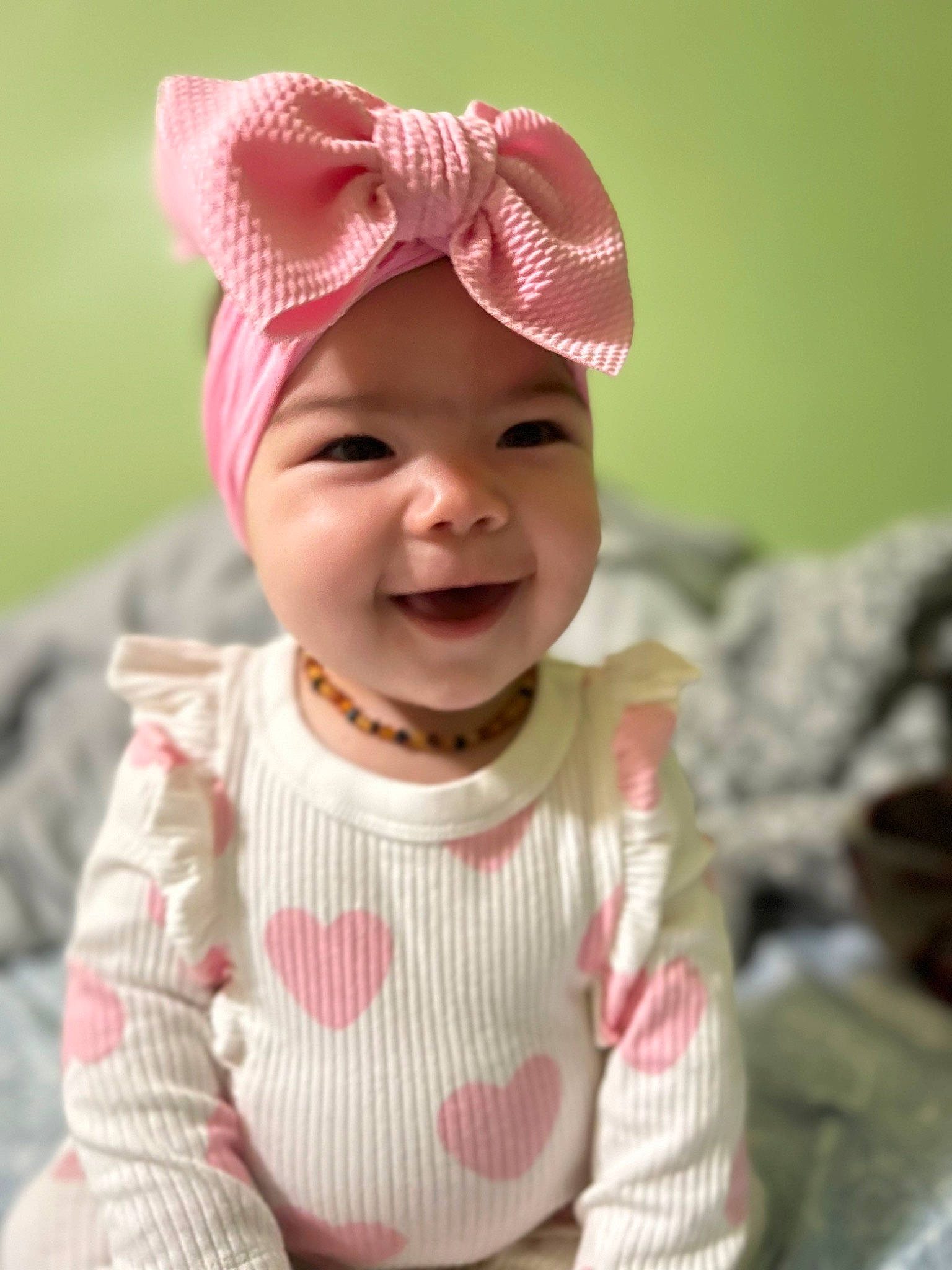 Klara joined the competition — help win amazing prizes! baby, baby_toddler_clothing, cap, cheek, chin, dress, eye, face, happy, head, headwear, lip, nose, outerwear, person, pink, product, skin, sleeve, smile