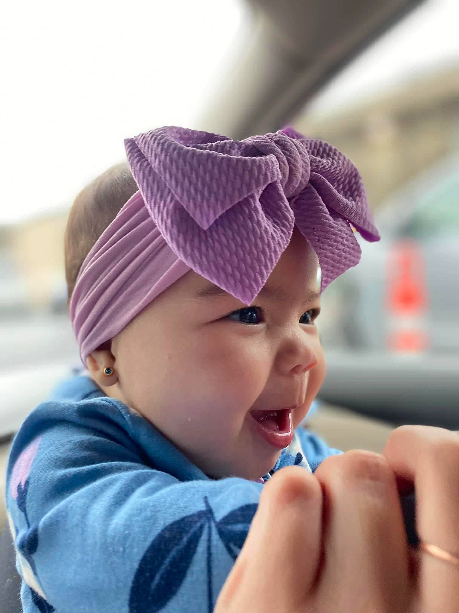 Klara joined the competition — help win amazing prizes! baby, baby_toddler_clothing, beanie, cap, child, electric_blue, fashion_accessory, fun, gesture, happy, headwear, knit_cap, lip, magenta, nail, person, pink, skin, smile, thumb