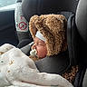 Alick a rejoint le concours — aidez-le/la à gagner de superbes lots ! baby, car_seat, blanket, pacifier, infant, sleeping, clothing, fuzzy_hat, child, cute, travel, interior, seatbelt, headwear, cozy, car, safety, comfort, portrait, young_child