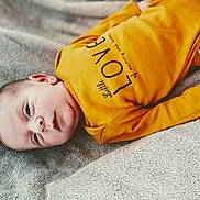 Malo participe au concours pour gagner de l'argent avec cette photo : baby, baby_sleeping, bedtime, child, ear, nap, outerwear, product, sleep, t_shirt, toddler, yellow