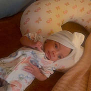 Kiisa joined the competition — help win amazing prizes! baby, blanket, butterfly_pattern, child, comfort, cozy, cushion, floral_pattern, headwrap, indoors, infant, lying_down, nursery, onesie, peaceful, person, pillow, resting, sleepwear, soft_texture