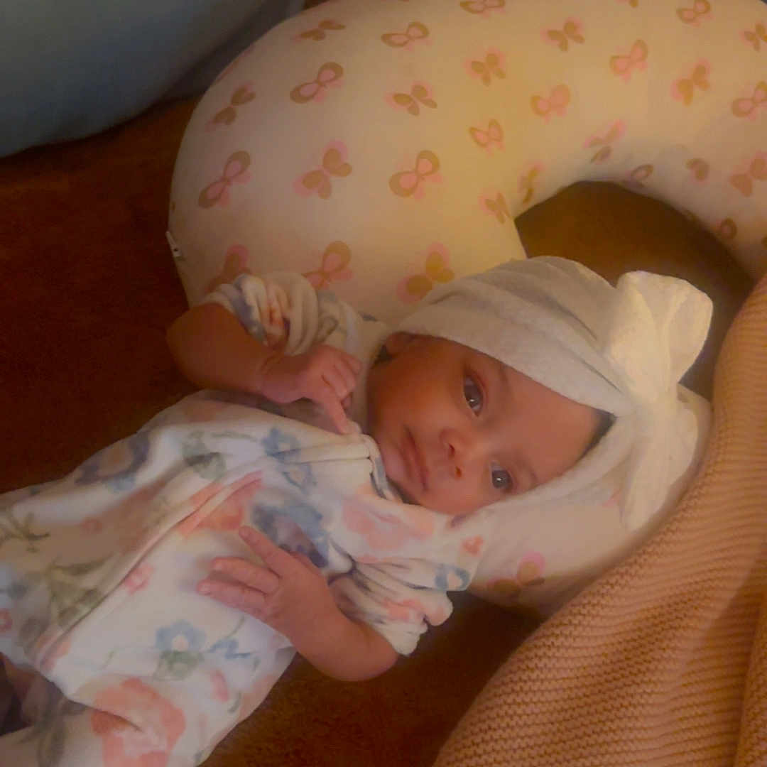 Kiisa joined the competition — help win amazing prizes! baby, blanket, butterfly_pattern, child, comfort, cozy, cushion, floral_pattern, headwrap, indoors, infant, lying_down, nursery, onesie, peaceful, person, pillow, resting, sleepwear, soft_texture