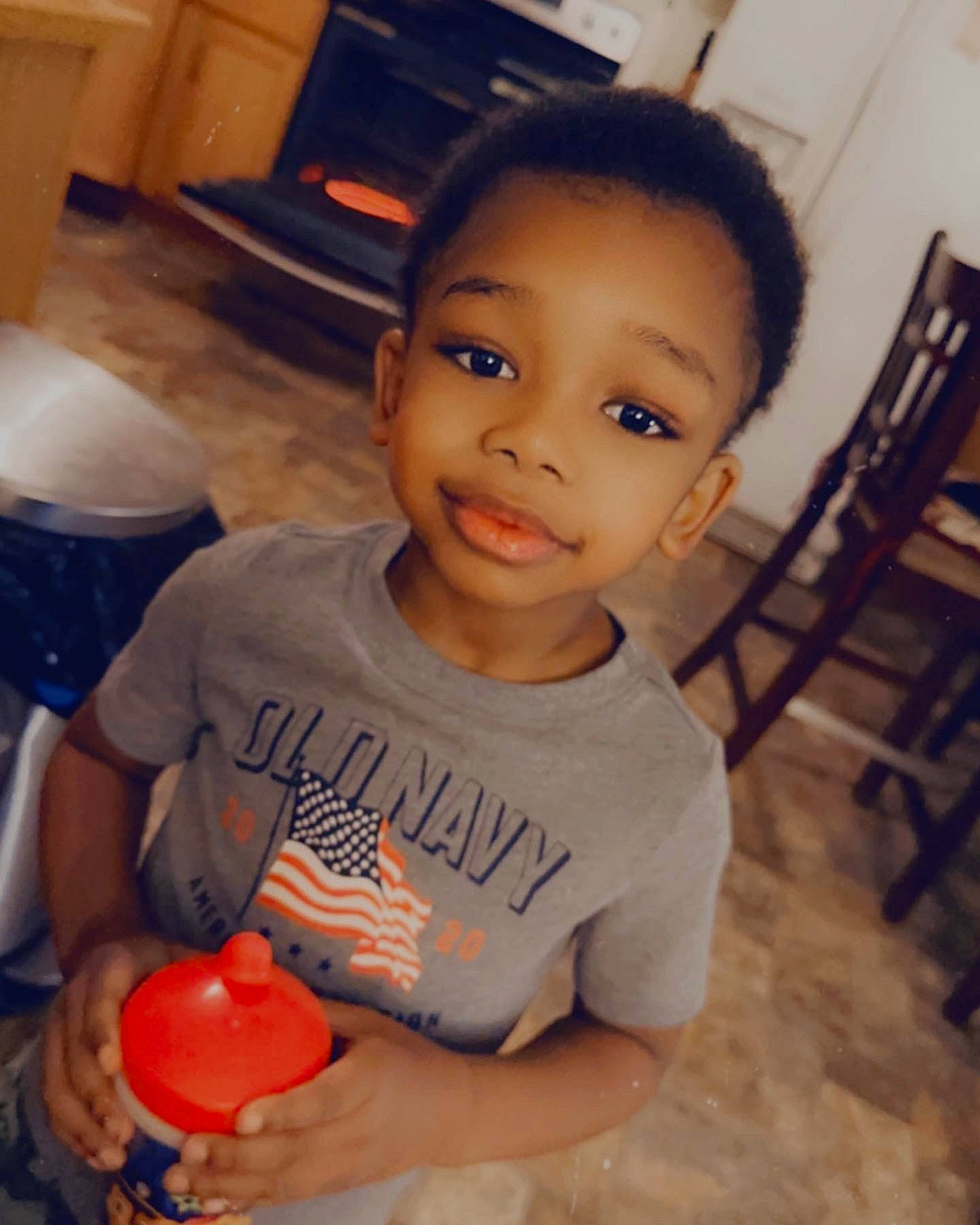 Elias joined the competition — help win amazing prizes! baby_toddler_clothing, chair, cheek, child, finger, flooring, fun, happy, joy, mouth, muscle, nose, organ, person, room, sitting, skin, smile, standing, t_shirt