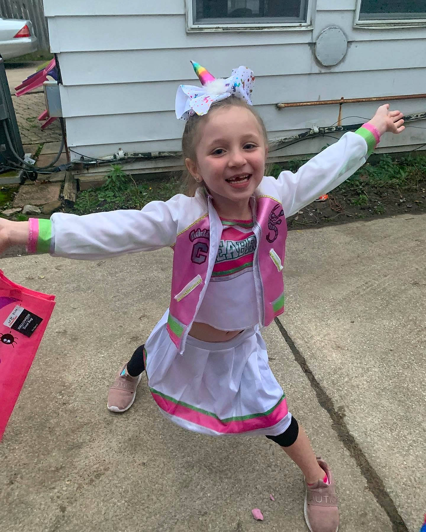 Shelby is registered to the contest to win money with this photo: baby, baby_toddler_clothing, chair, child, costume, event, fashion_accessory, fun, grass, happy, joy, leisure, magenta, person, pink, recreation, sandal, smile, toddler, vacation