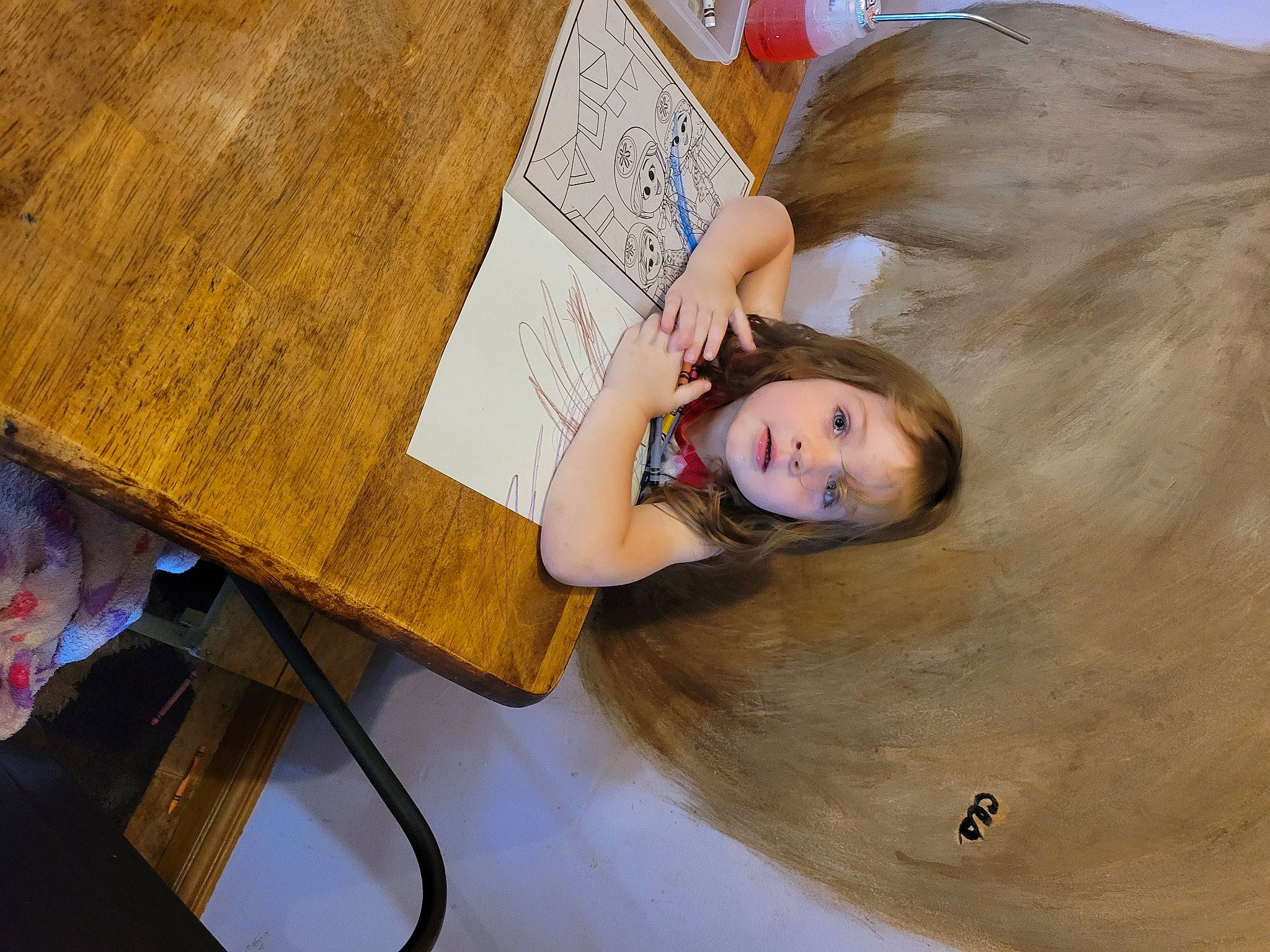 Kora is registered to the contest to win money with this photo: child, eyelash, flooring, fun, happy, hardwood, jewellery, leisure, person, room, sitting, table, wood, wood_stain, writing