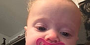 Annabella joined the competition — help win amazing prizes! baby, pacifier, face, hair, onesie, indoor, child, infant, close_up, expression, pink, sleepy, person, portrait, cute, young, cozy, home, head, skin
