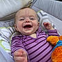 baby, smiling, purple_striped_clothing, plush_toy, infant, cushioned_seat, happy, reaching_hand, face, person, portrait, indoor, child, cute, comfort, soft_toys, playful, closeup, head, young_child