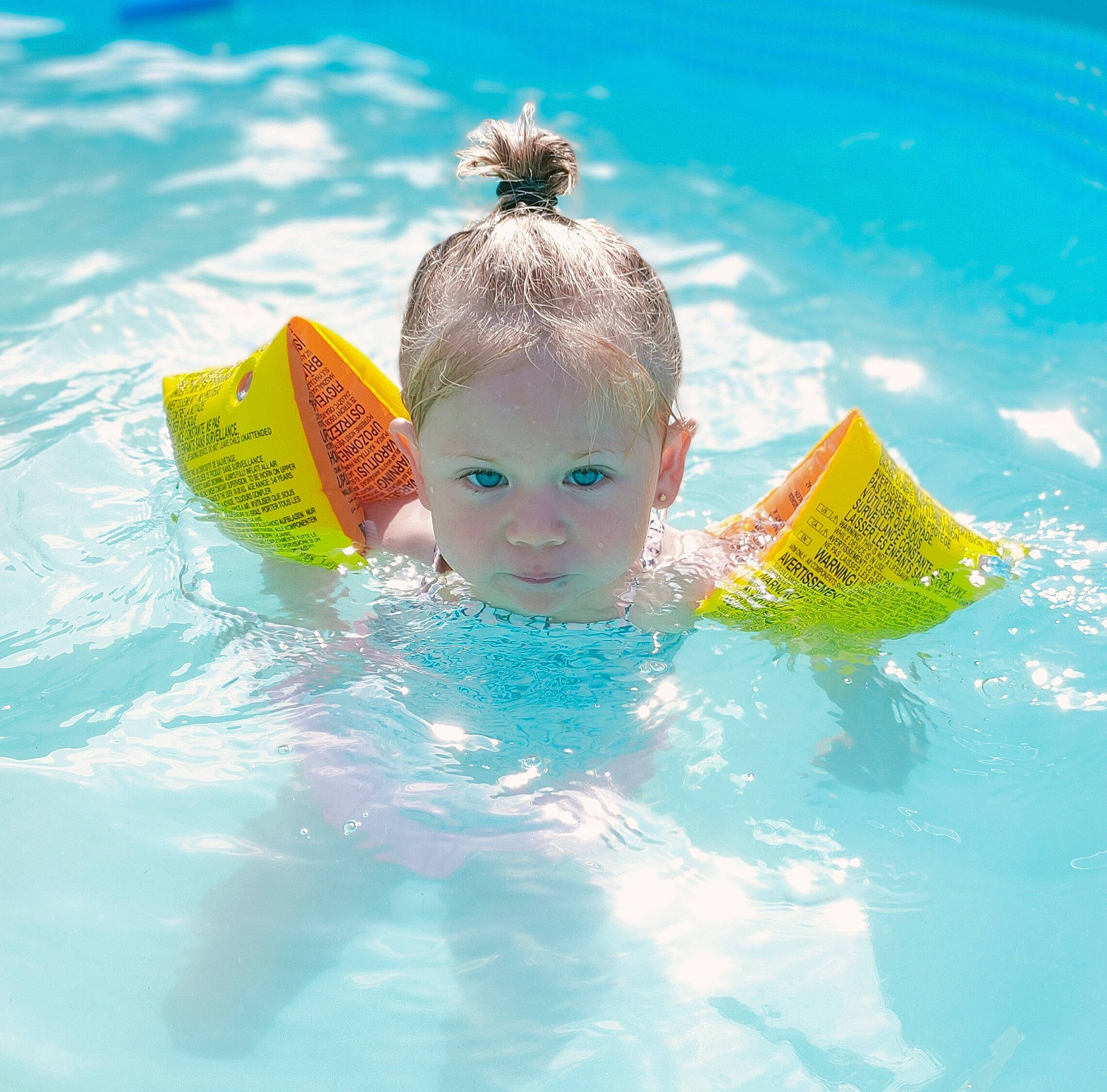Eve participe au concours pour gagner de l'argent avec cette photo : aqua, baby_float, child, fun, games, leisure, leisure_centre, person, play, product, recreation, summer, swimming, swimming_pool, toy, vacation, water, water_park