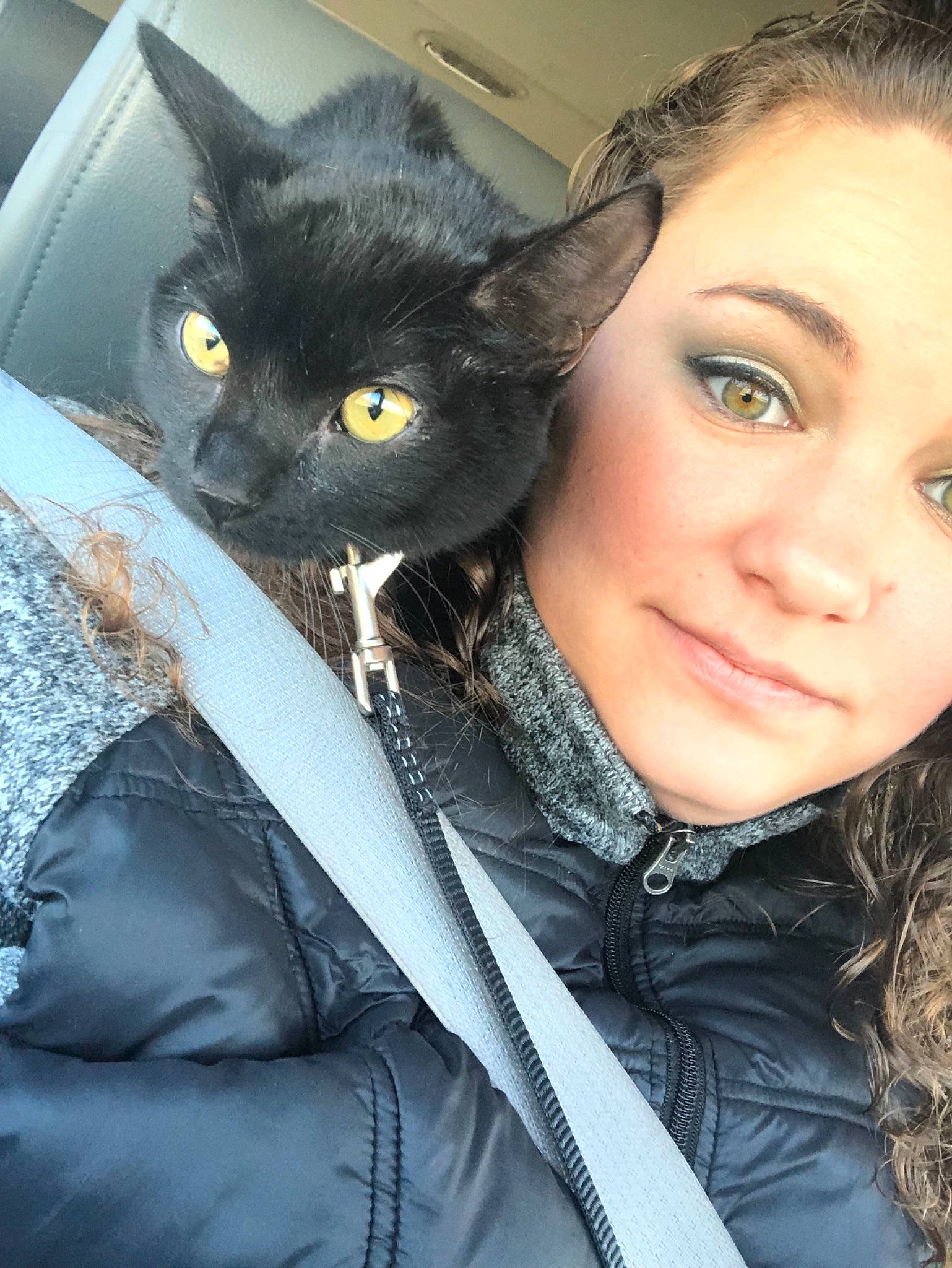 Karen is registered to the contest to win money with this photo: black_cat, black_hair, carnivore, cat, domestic_short_haired_cat, ear, eye, felidae, fur, hair, iris, long_hair, nose, organ, person, photography, selfie, skin, small_to_medium_sized_cats, snout