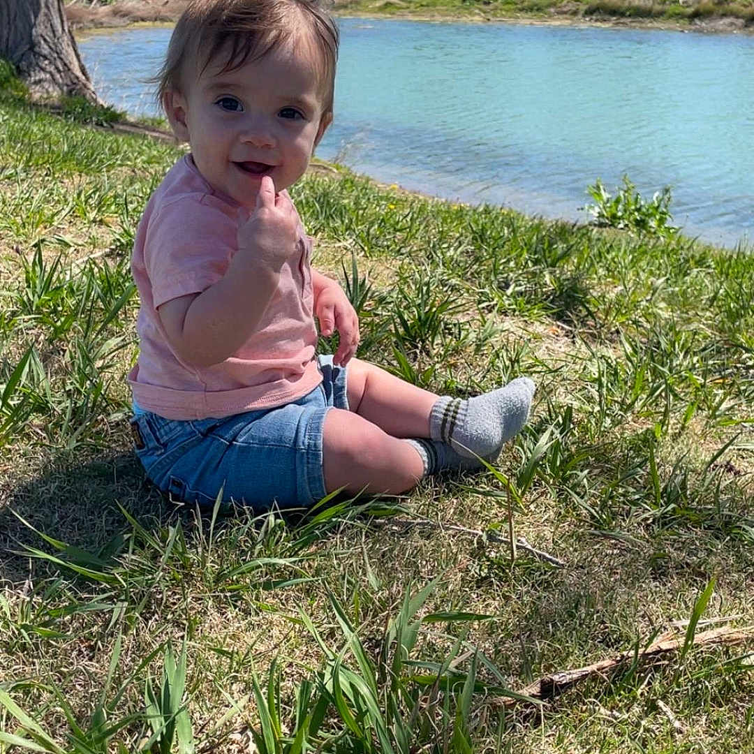 Kane is registered to the contest to win money with this photo: clothing, face, grass, grove, head, lake, land, nature, outdoors, pants, park, person, photography, plant, pond, portrait, summer, tree, vegetation, water