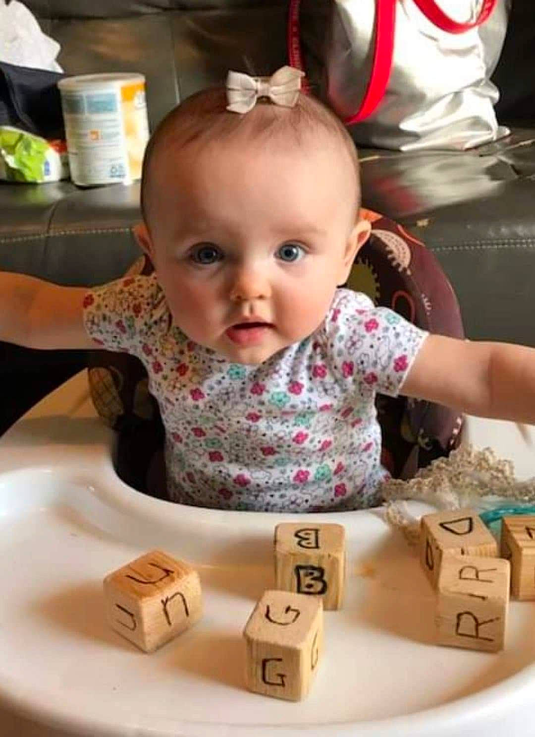 Avery is registered to the contest to win money with this photo: arm, baby, baby_toddler_clothing, beauty, chair, cheek, eye, facial_expression, fun, happy, head, human, indoor_games_and_sports, iris, nose, people, person, product, skin, toddler