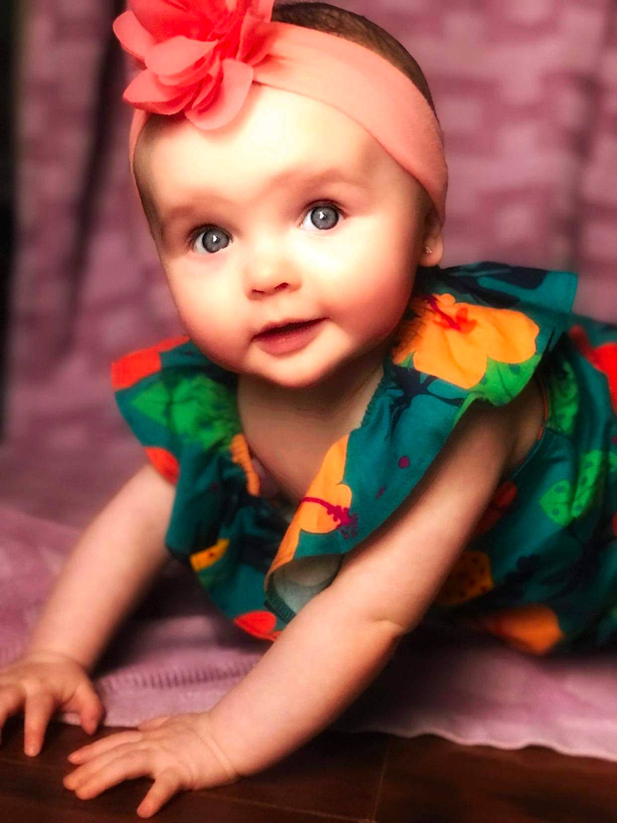 Avery joined the competition — help win amazing prizes! baby_toddler_clothing, cap, costume_hat, dress, finger, flash_photography, flower, hand, happy, hat, headgear, headpiece, headwear, leaf, lip, orange, person, petal, pink, red