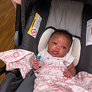 Saleen joined the competition — help win amazing prizes! baby, infant, car_seat, blanket, pink, pacifier, pacifier_clip, smartphone, socks, face, eyes, hands, clothing, head_support, wood_floor, indoor, portrait, newborn, cute, cozy