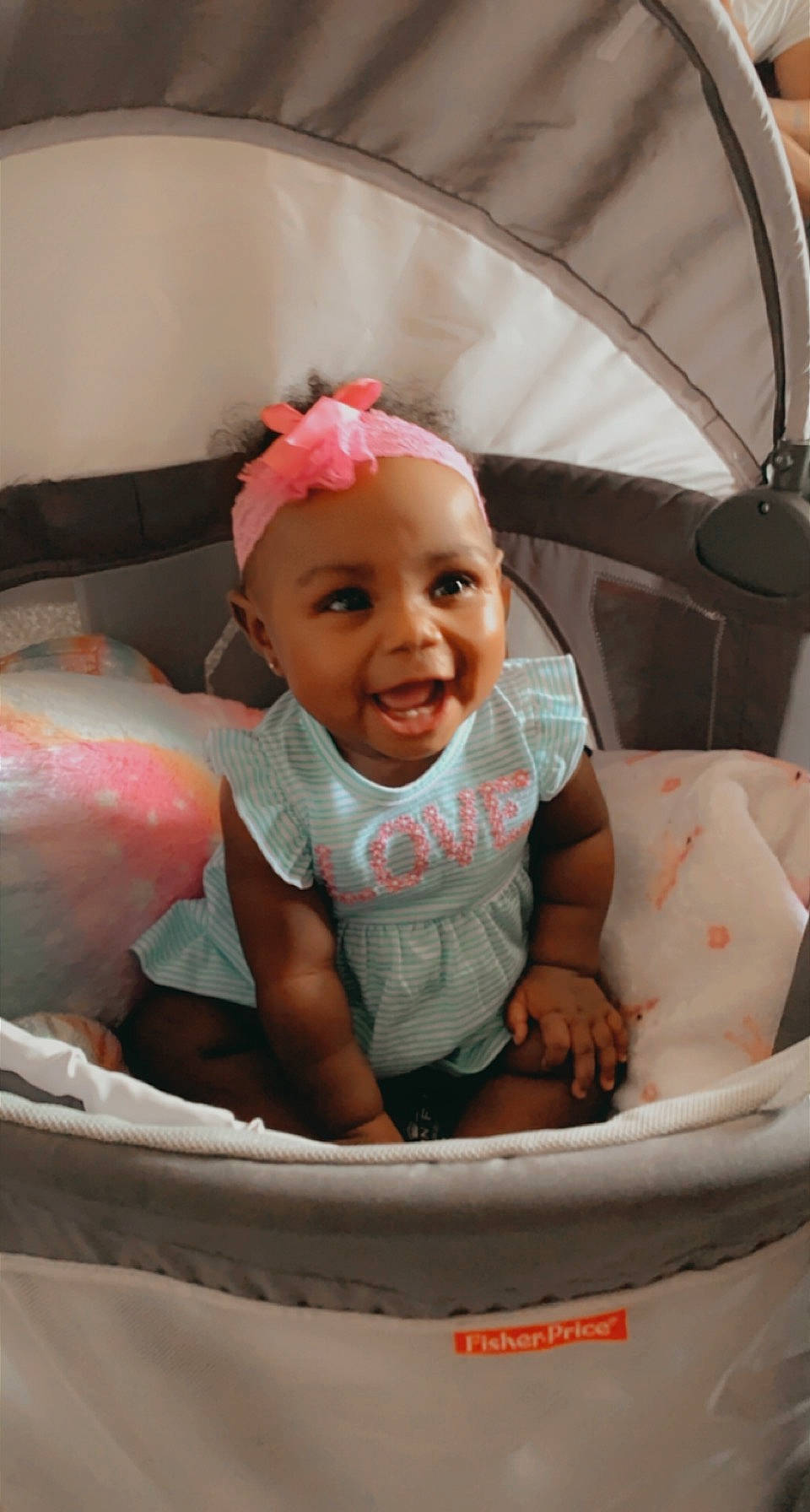 Jadé is registered to the contest to win money with this photo: baby, baby_products, baby_toddler_clothing, child, circle, comfort, fashion_accessory, fun, happy, hat, magenta, person, pink, product, sitting, skin, smile, t_shirt, toddler, vacation