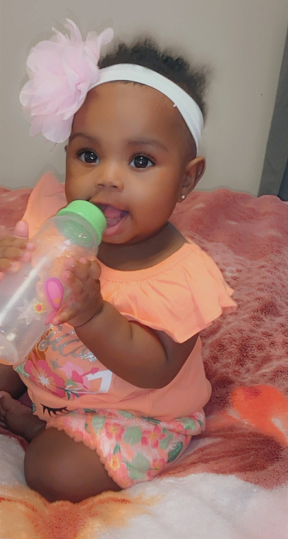 Jadé joined the competition — help win amazing prizes! baby, baby_bottle, baby_toddler_clothing, cheek, child, costume_hat, drinkware, face, facial_expression, finger, fun, happy, head, headpiece, headwear, nail, person, pink, plastic_bottle, skin