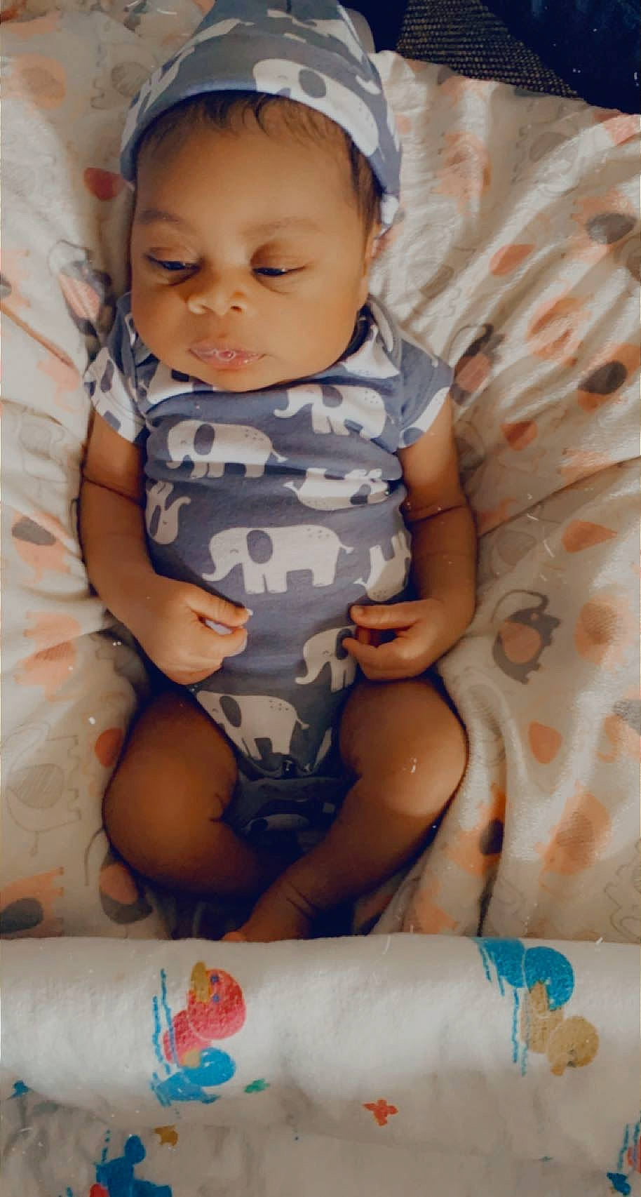 Jakari joined the competition — help win amazing prizes! baby, baby_toddler_clothing, beauty, blue, cheek, chest, child, comfort, eye, face, facial_expression, pattern, person, photograph, pink, skin, stomach, thigh, toddler, trunk