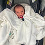 Jaxon is registered to the contest to win money with this photo: baby, blanket, car_seat, child, clothing, comfort, cute, fabric, face, head, indoor, infant, newborn, person, portrait, resting, seatbelt, soft, wrapped, young