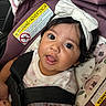 Valerie joined the competition — help win amazing prizes! baby, child, car_seat, white_bow, headband, straps, floral_pattern, cute, portrait, indoors, infant, face, eyes, tongue, clothing, pink, black_hair, skin, safety, seat